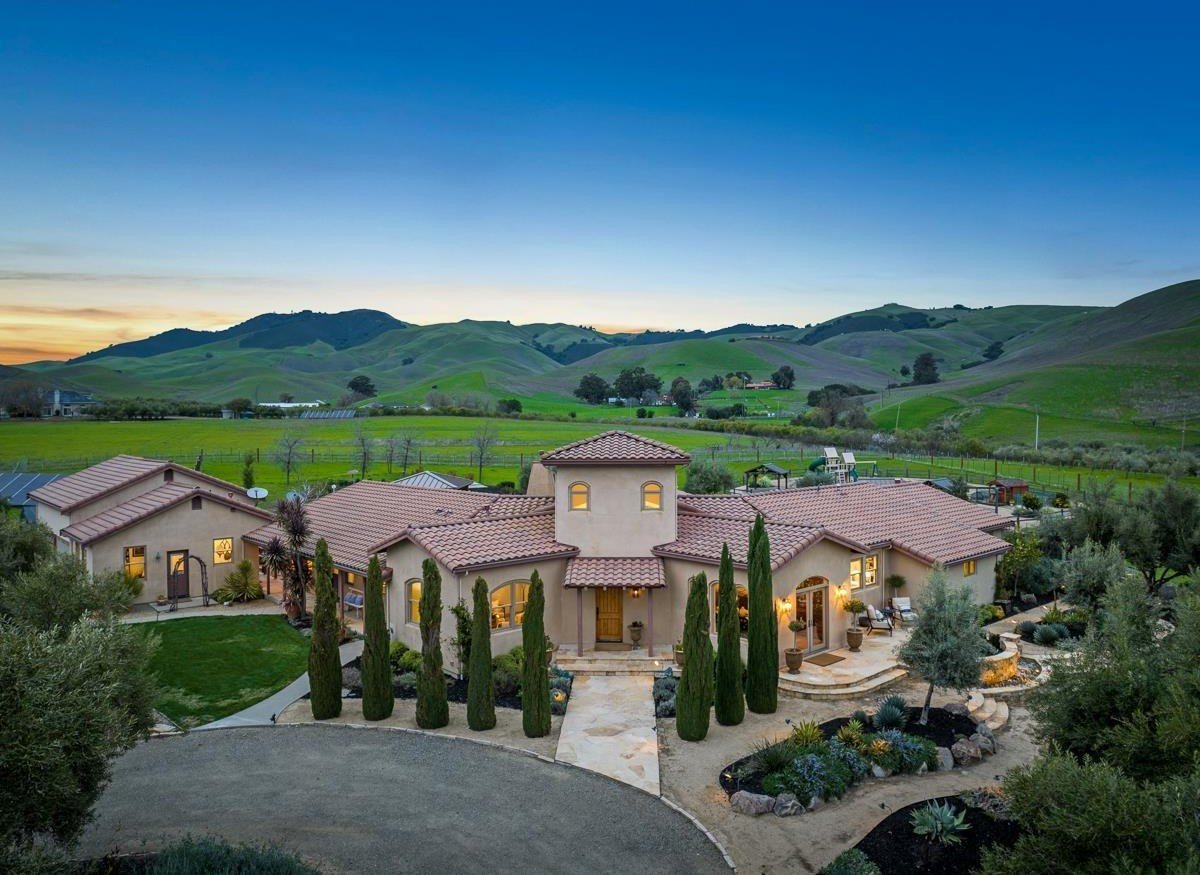 Bay Area estate at dusk, surrounded by rolling hills